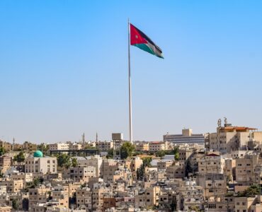 city in jordan with national jordanian flag
